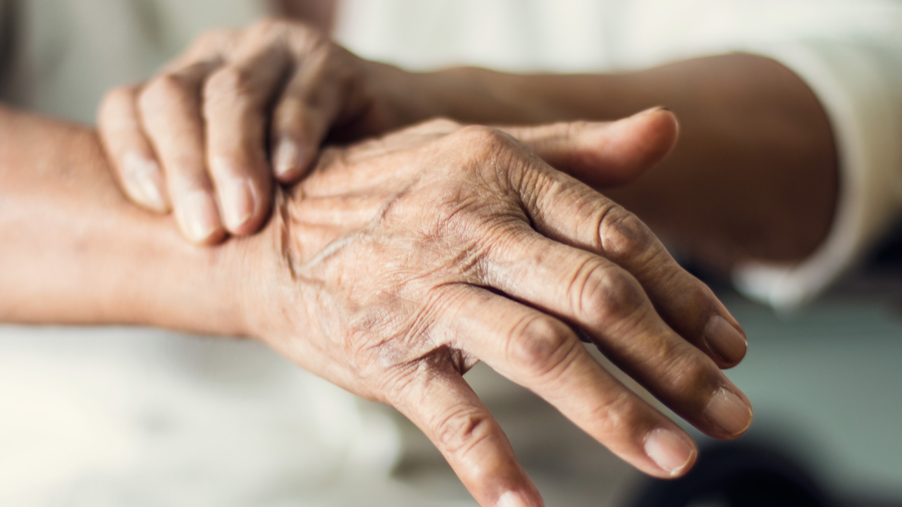 Close up hands of senior elderly woman patient suffering from pakinson's desease symptom. Mental health and elderly care concept. Image Credit: Adobe Stock Images/ipopba