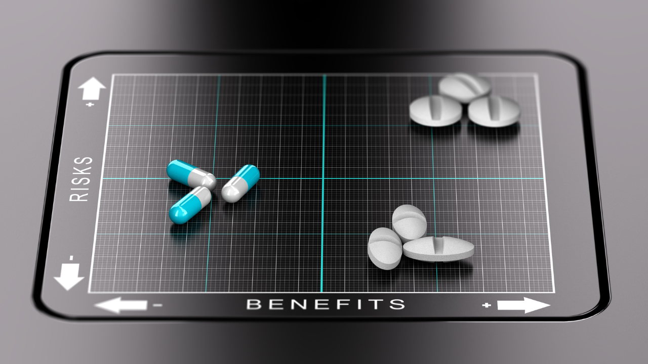 3D illustration of a benefits versus risks matrix with pills and tablets positioned on it. Evaluation of drugs, healthcare concept. Image Credit: Adobe Stock Images/Olivier Le Moal